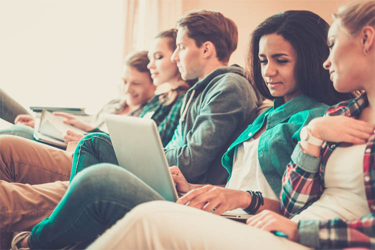 group of university students on laptop