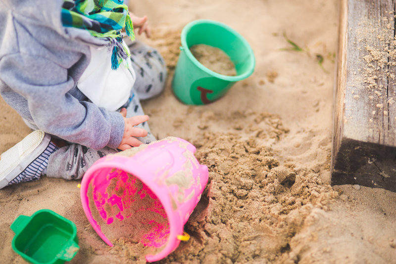 Child building sandcastles