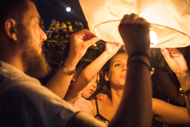 Family lighting a lantern