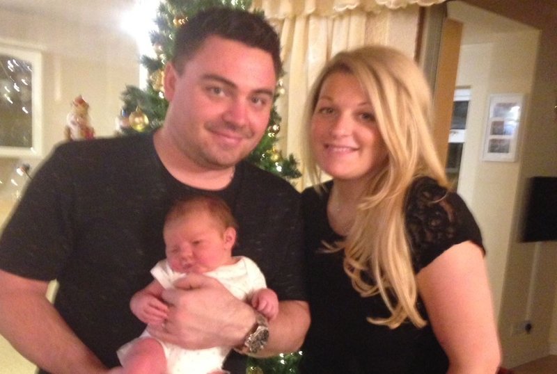 Couple holding new born baby