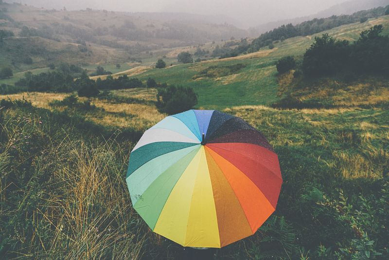 Multicoloured golf umbrella showing income protection insurance types