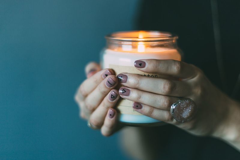 Person holding a candle