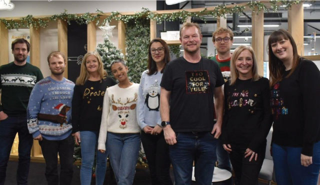 some shepherds friendly employees in festive jumpers
