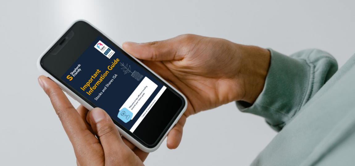 Person holding a phone displaying Shepherds Friendly's Important Information Guide and the Clear and Simple mark